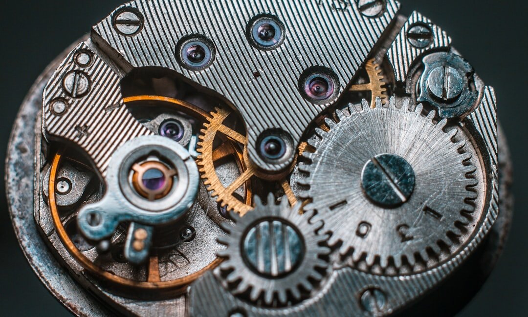 Macro detail of an exposed watch movement with visible gears
