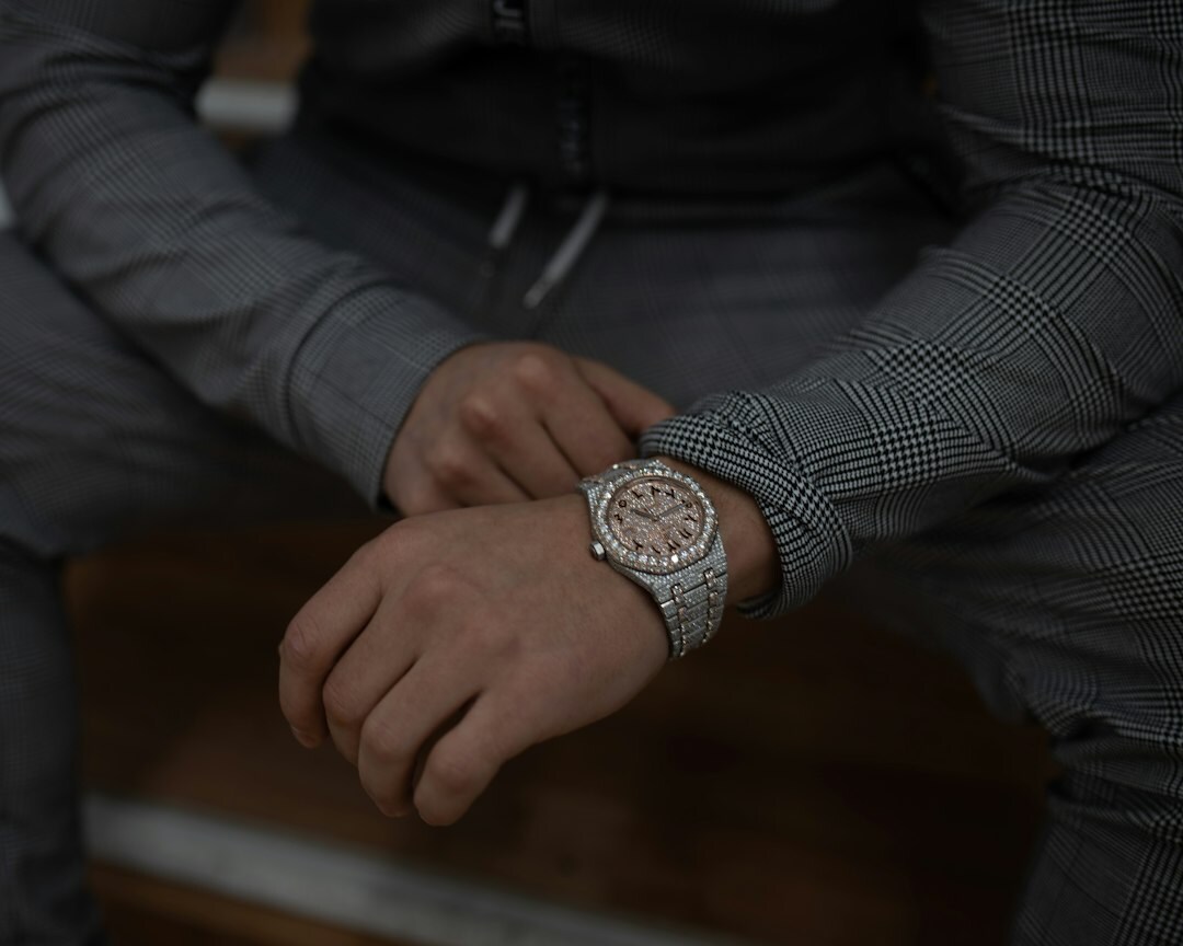 Elegant hands of a Latin American man adjusting a luxury wristwatch
