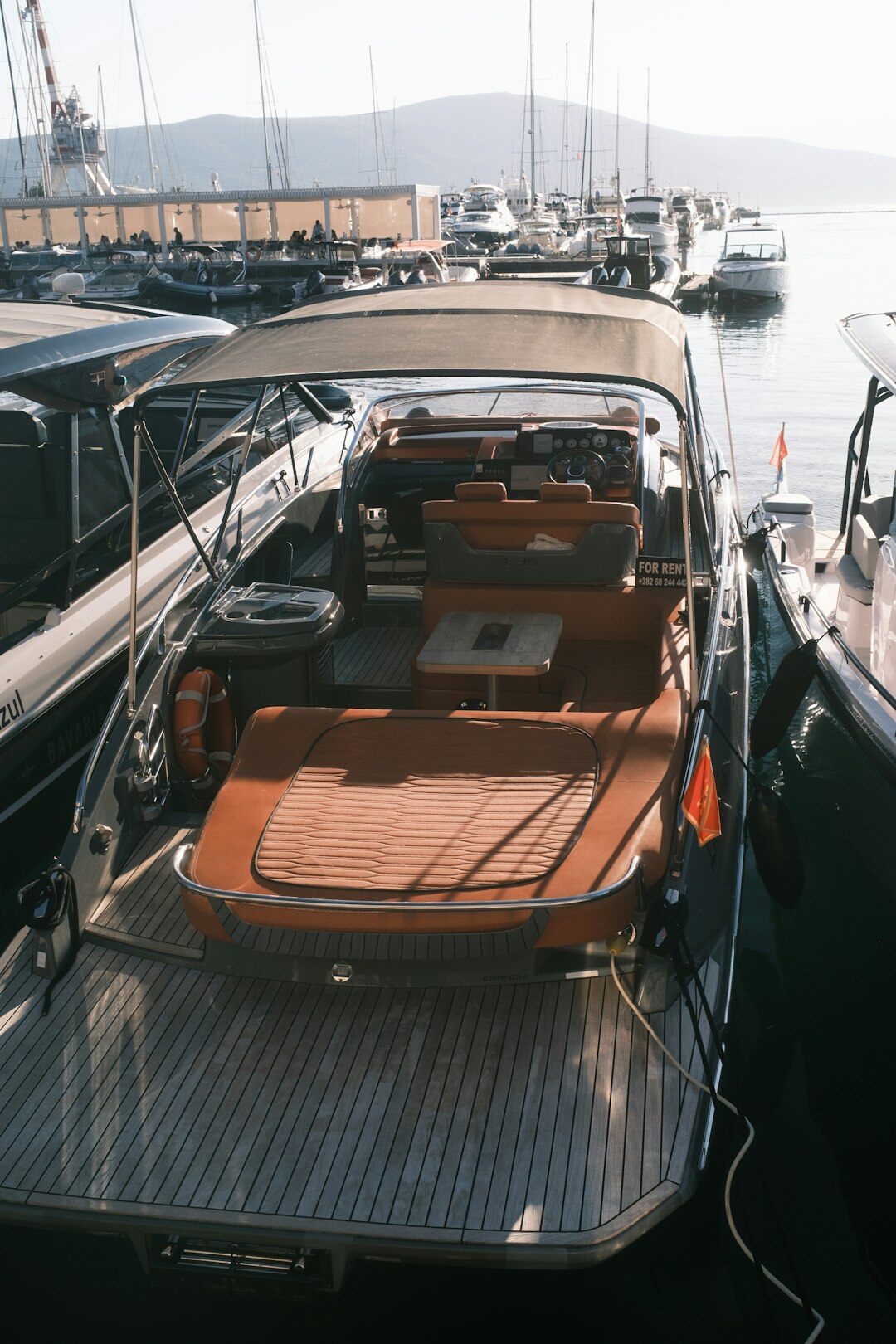 Luxury diver chronograph watch beside a yacht deck