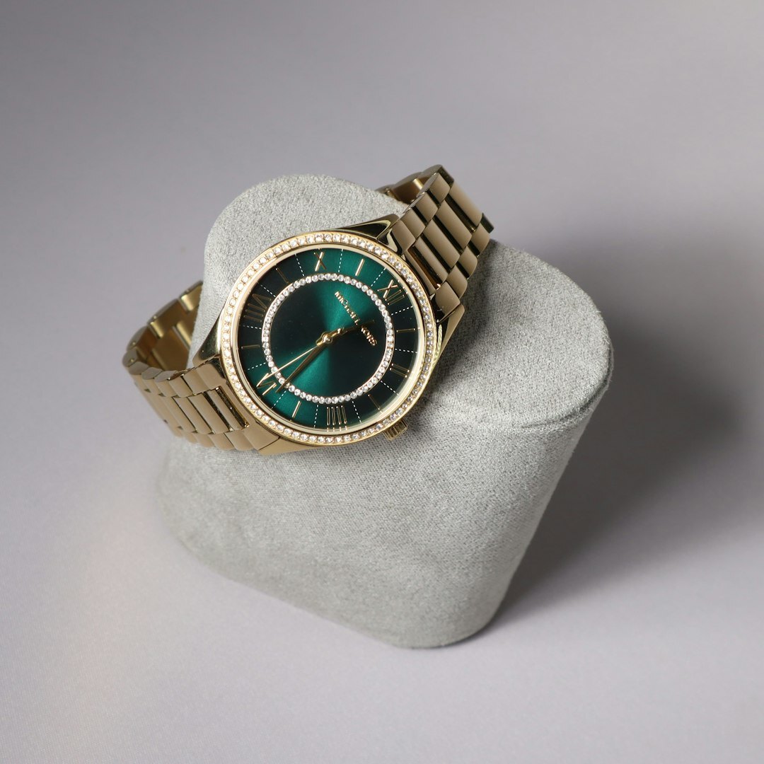 Luxury dress watch with gold case on dark velvet