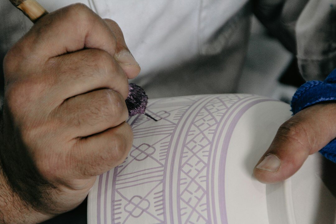 Swiss watchmaker examining a movement at a workbench